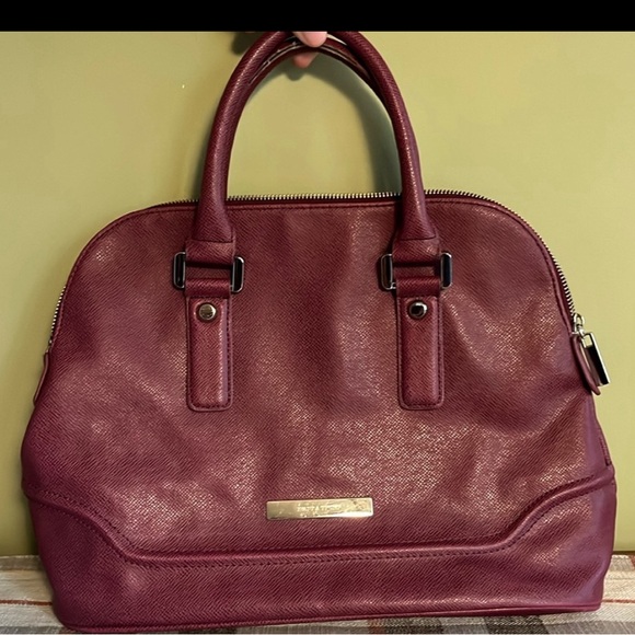 Ivanka Trump Handbags - Ivanka Trump Bag maroon color good condition